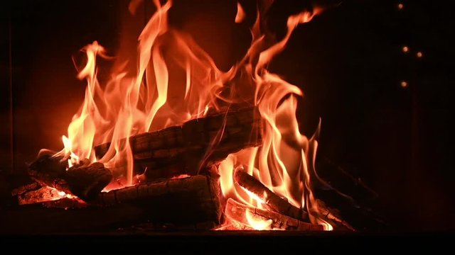 romantic burning wood stove fire in slow motion