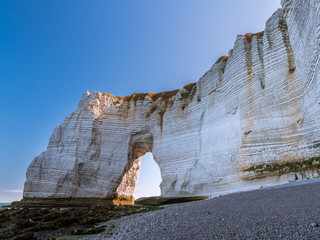 Chalk cliffs of Etretat with the natural arch called Manneporte