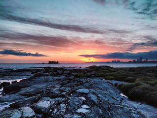 Sunset beyond the island.