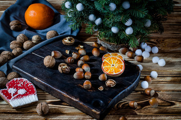 Tree, Orange, orange slices and biscuits snowflakes lie on the wood table