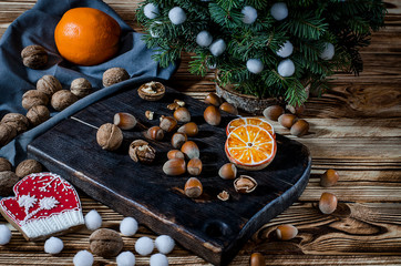 Tree, Orange, orange slices and biscuits snowflakes lie on the wood table