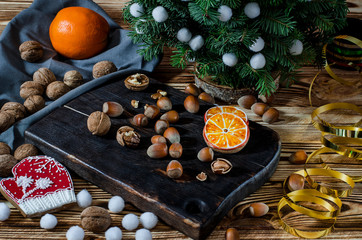 Tree, Orange, orange slices and biscuits snowflakes lie on the wood table