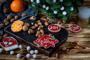 Tree, Orange, orange slices and biscuits snowflakes lie on the wood table