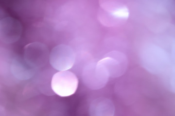 Bokeh photo. Holiday background. Christmas lights. Defocused sparkles. New Year backdrop. Festive...