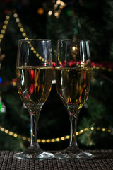 two glasses of champagne on christmas background 