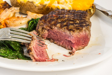 Eating Rare Filet Mignon with Shrimp and Twice-baked Potato