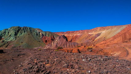 Fototapeta na wymiar The Valle del Arcoiris is located about 90 kms from San Pedro de Atacama in Chile, close to Yerbas Buenas Petroglyphs. It owes its name to the variety of colors that can be seen in the valley.