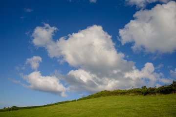 green hill and blue sky