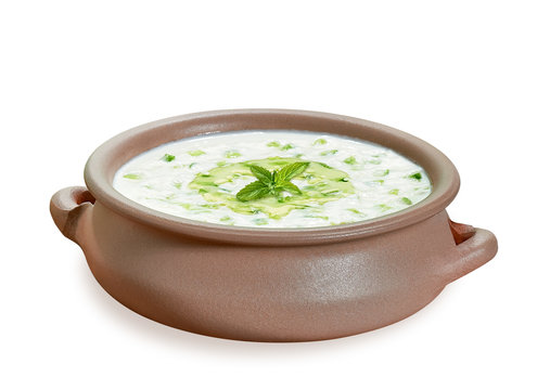 Turkish or Greek cuisine  tzatziki or cacik, cucumber and yogurt salad with mint leaves including clipping path 