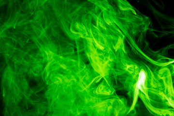 Green smoke on black background