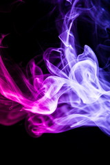 Colored smoke on black background