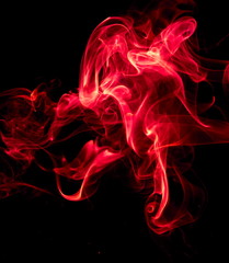 Fototapeta premium Red smoke on black background