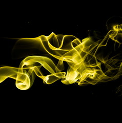 Yellow smoke on black background