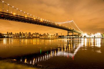 View of RFK Triborough Bridge from Astoria Queens towards Roosevelt Island and Manhattan New York City seen at night
