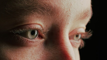 Fototapeta premium close up macro eye opening blinking light reflection on iris beauty