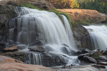 Motion-blurred waterfall cascading over rocks