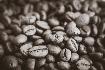 Beautiful texture of freshly roasted selected delicious rich brown natural fragrant coffee tree grains, Arabica coffee beans, Robusta. Flat lay and copy space. The background.