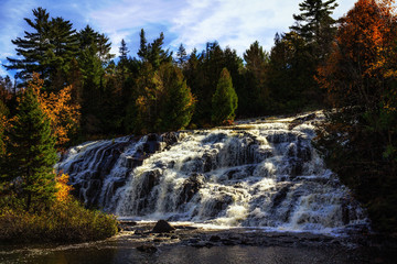 Bond Falls waterfall in Michigan's Upper Peninsula. Spectacular autumn waterfall background with copy space.