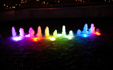 Rainbow Colored water fountain at night