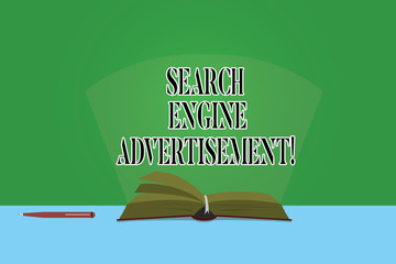 Text sign showing Search Engine Advertisement. Conceptual photo Placing online advertisements on webpages Color Pages of Open Book photo on Table with Pen and Light Beam Glaring