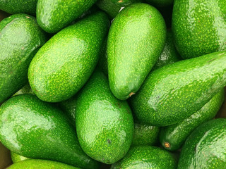 Background of fresh green avocado closeup © peppystudio