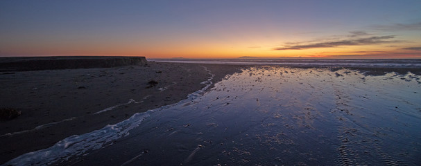 Sunset over Santa Clara River tidal estuary outflow to Pacific Ocean at McGrath State Park on the California Gold Coast at Ventura - United States
