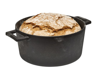 No knead or sourdough hand made bread in black cast iron pot isolated on white background including...