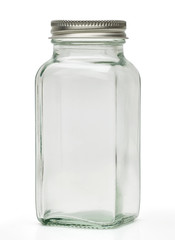Clear empty glass canister or jar with silver cap isolated on white background with clipping path