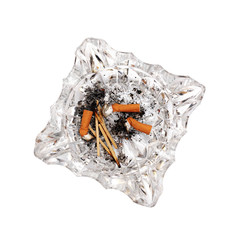 top view of cigarette butts in a glass ashtray isolated on a  white background
