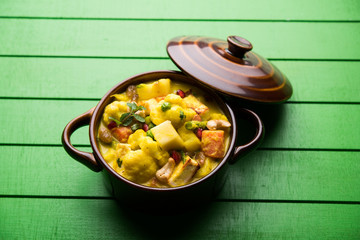 Navratan Korma is a rich, creamy and flavorful Mughlai dish  from India that literally translates to nine-gem curry. The “gems” are the fruits, vegetables and nuts that make up the curry. 