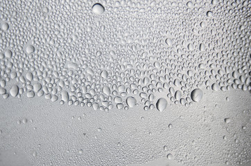 Background and wallpaper by rainy drop and water drops on window glass.