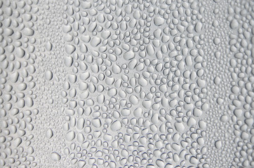 Background and wallpaper by rainy drop and water drops on window glass.