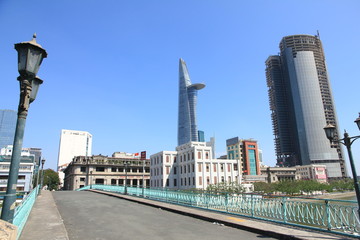 Naklejka premium Historical Building with Skyscrapers in the Background in Ho Chi Minh City, Vietnam