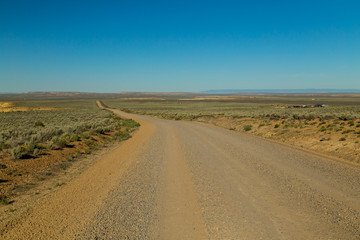 Fototapeta na wymiar Section of long Gravel Road to Chaco Canyon National Historic Park