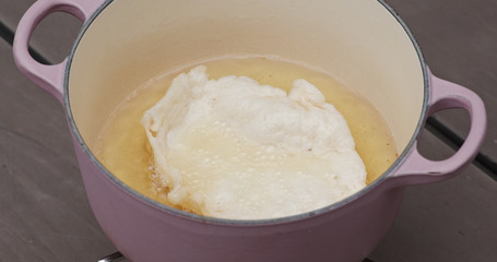 Cook prawn cracker in oil