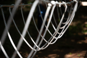 A rope bridge at a backyard low ropes course