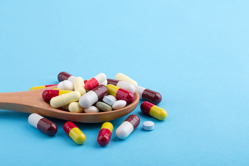 Medicine Pills Tablets And Capsules On Wooden Spoon