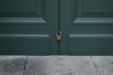 master key lock on green wooden door