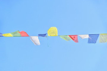Colourful Tibetan Prayer Flags Isolated Against Blue Skies