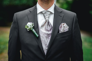 groom wearing a tie close up