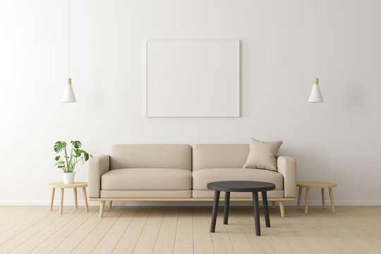 Minimal concept. interior of living beige fabric sofa, wooden table, ceiling lamp and frame on wooden floor and white wall.