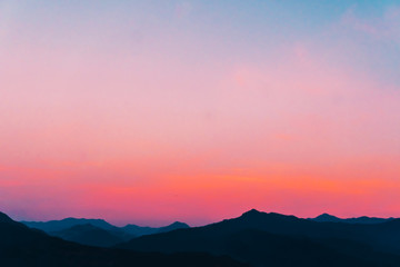 Mountain scenery view landscape with twilight sky beautiful magenta color tone theme sunset and sunrise background.