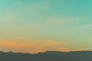 Mountain scenery view landscape with twilight sky beautiful magenta color tone theme sunset and sunrise background.