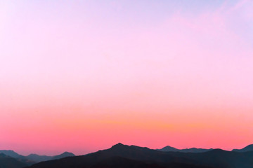 Mountain scenery view landscape with twilight sky beautiful magenta color tone theme sunset and sunrise background.