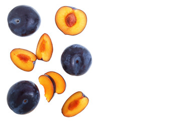 plums isolated on a white background with copy space for your text. Top view. Flat lay pattern