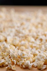Scattering of salted popcorn on the table close-up. Oscar Film Academy Concept. Snacks and food to watch the movie.
