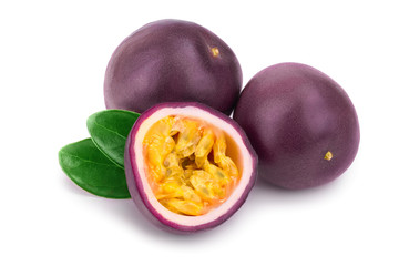 Two whole passion fruits and a half with leaves isolated on white background. Isolated maracuya