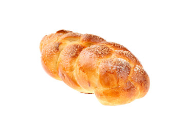 Traditional Bulgarian sweet leavened bread Kozunak, braided and sprinkled with sugar, isolated on white. In Bulgaria Kozunak is mainly prepared for Easter, but can be found in bakeries year round