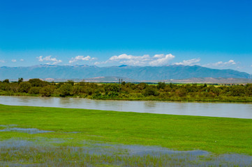 landscape with lake and blue sky