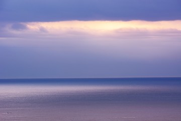 Reflection on the surface of the sea at dawn